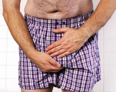 Обострянето на простатит при мъжете се проявява с болка в скротума и перинеума